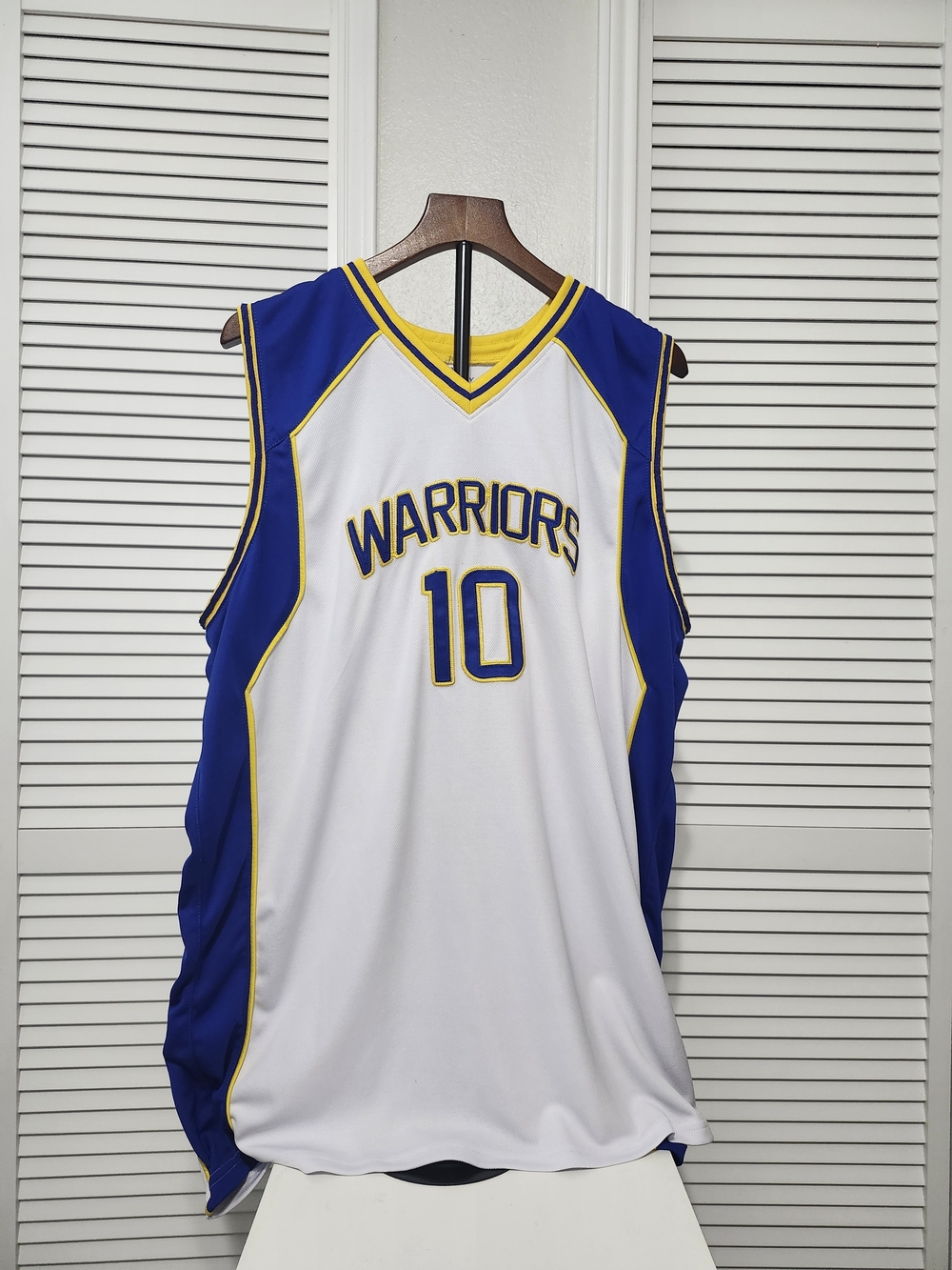 White Blue Yellow Warriors Basketball Jersey — #10